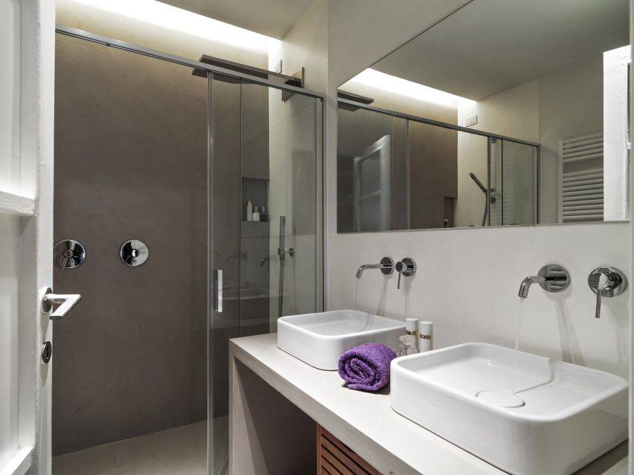 interior view of a modern bathroom in the foreground two washbasin Фото -